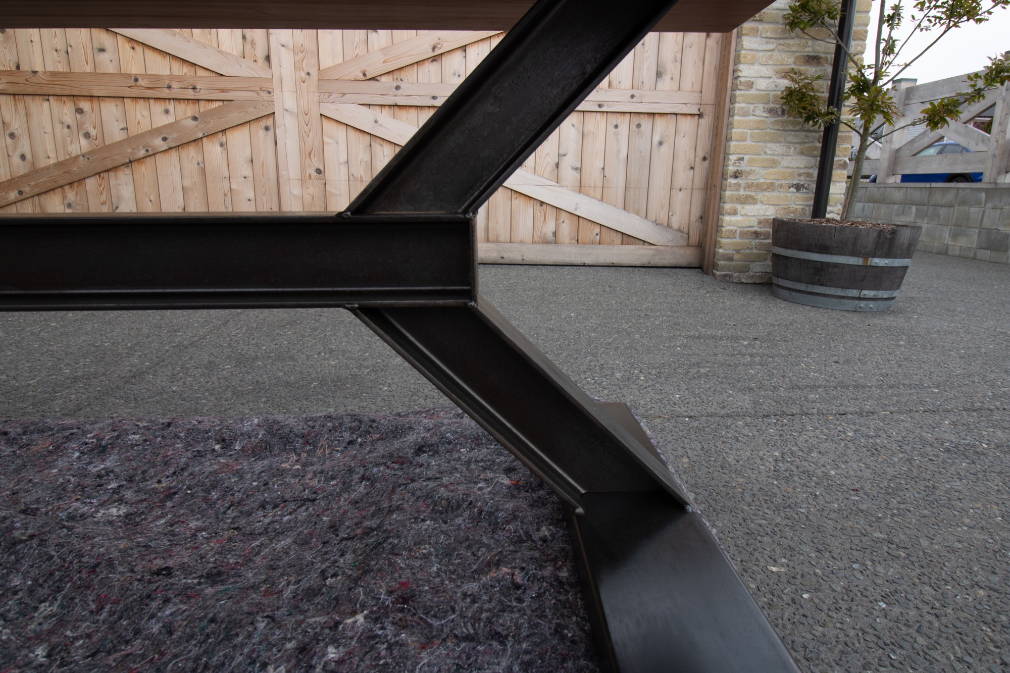 Fabricated raw steel structure beneath the Ancient Kauri River Table